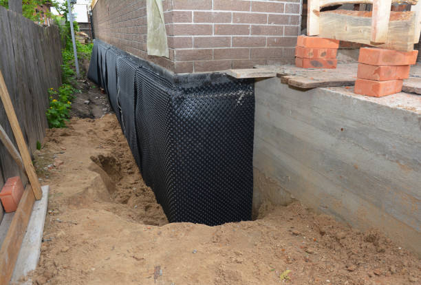 Happy homeowners after waterproofing job in Woodberry Forest